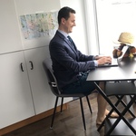 <img src="funny-telehealth-posture.jpg" alt="man on telehealth wearing suit and shorts">